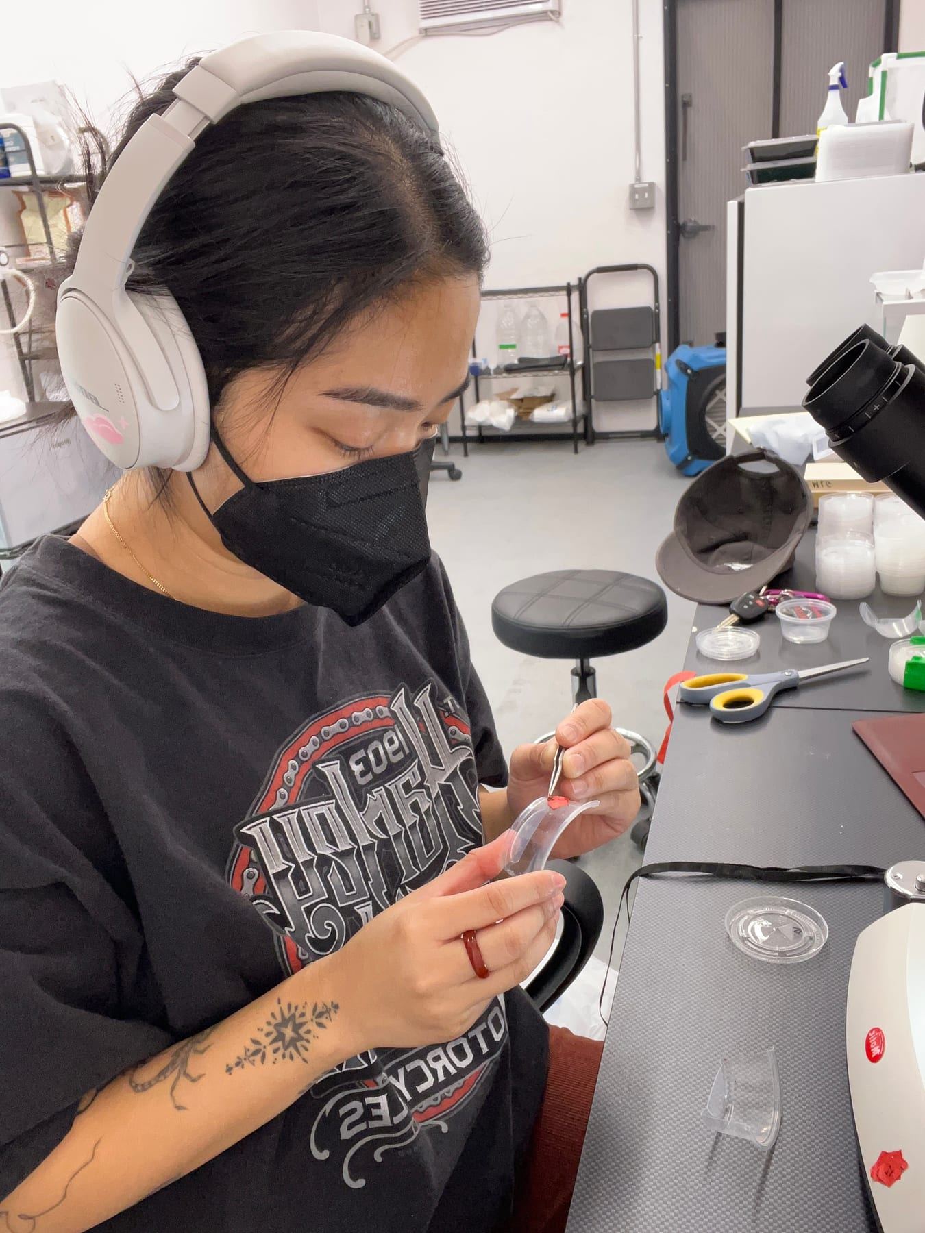 An M3 technician counting egg hatch from sterility trials under magnification