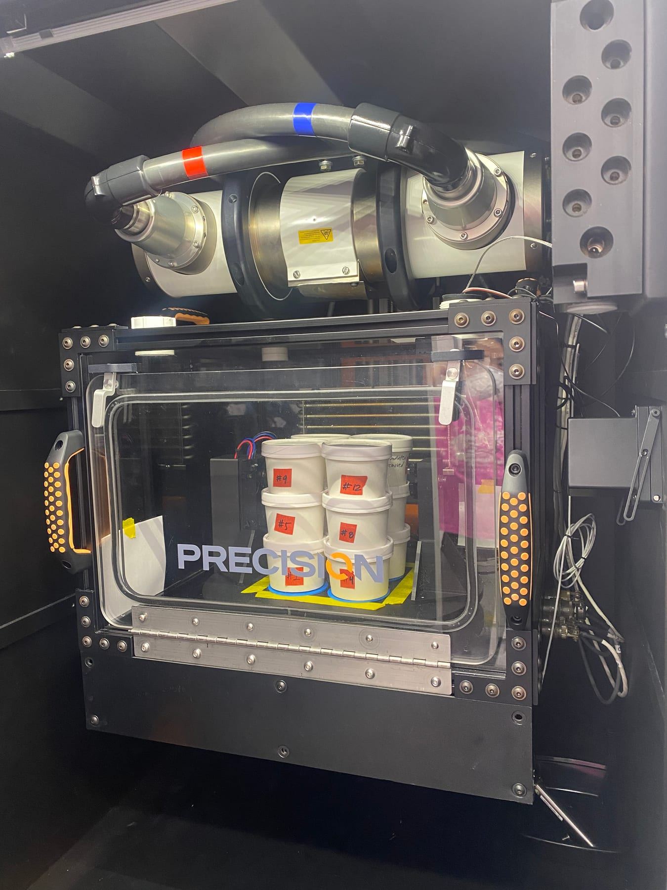 Sample cups inside the Precision X-ray cabinet at M3's Phoenix lab, ready for sterilization