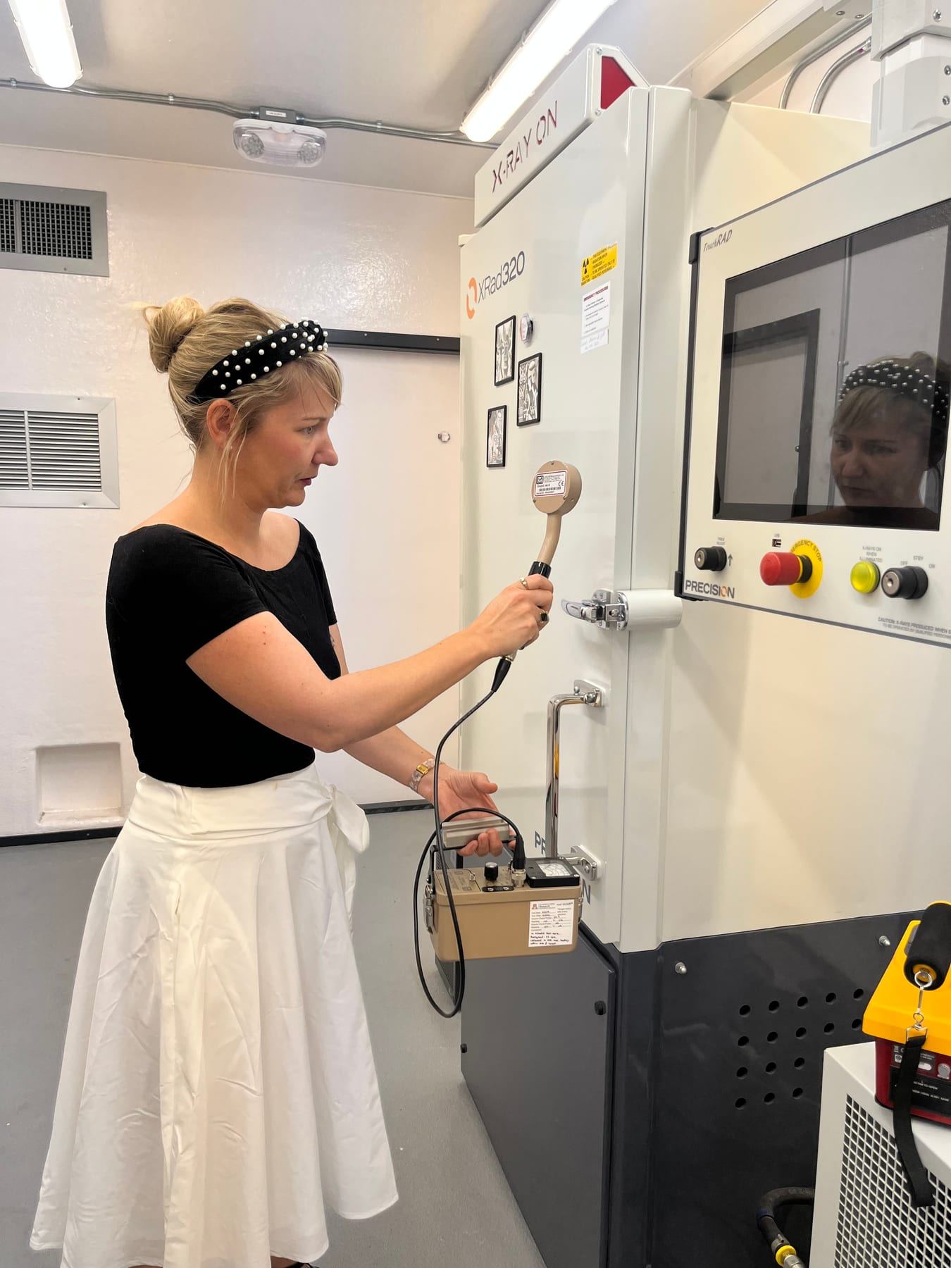 Dr. Marion Le Gall running a radiation safety survey at M3's XRad 320 X-ray sterilization unit