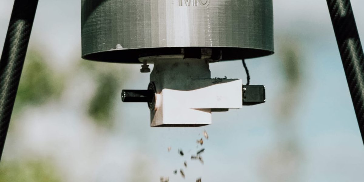 The M3 release device under a drone dropping sterile codling moths